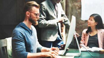 Business Team working together on a mac
